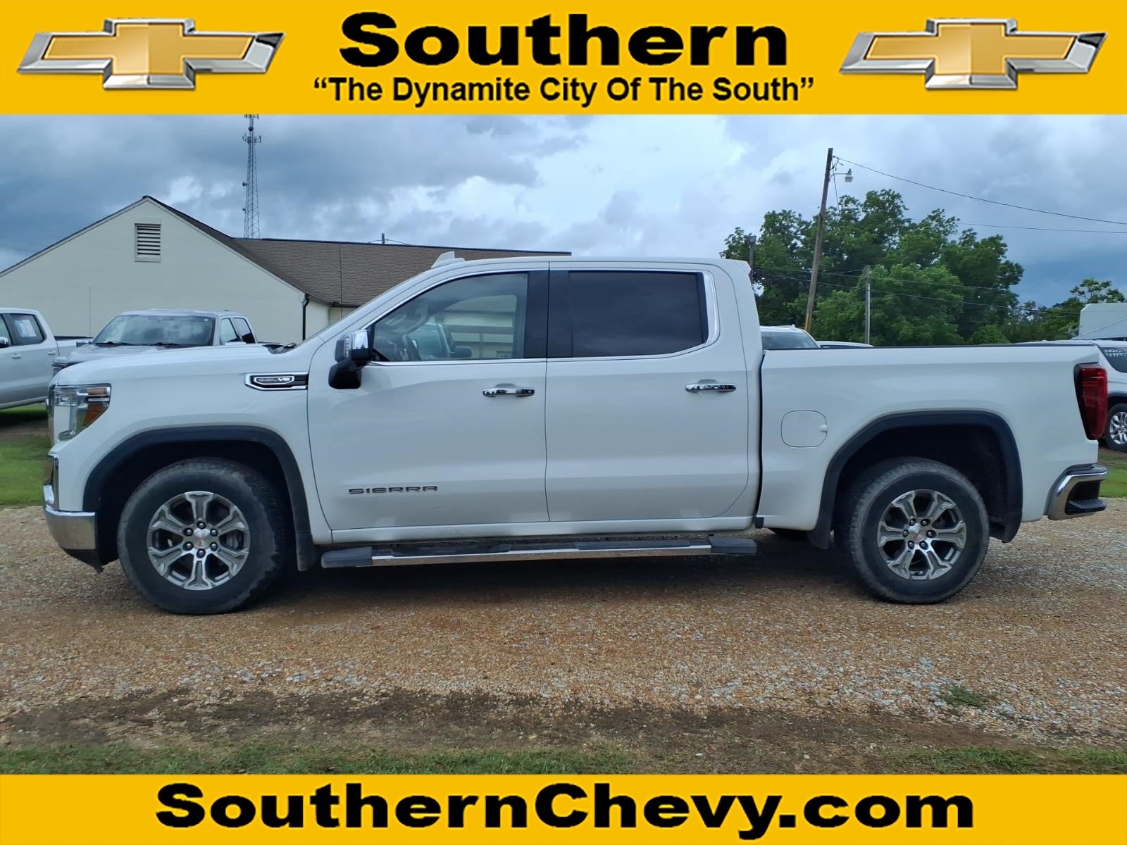 2019 GMC Sierra 1500 SLT in Summit White — front three-quarter view